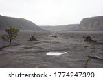 The floor of the solidified Kīlauea Iki Crater lava lake in Hawaii Volcanoes National Park on a rainy day.