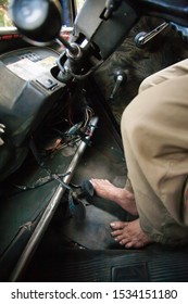 The Floor Of A Taxi In Mumbai, India, Showing The Taxi Driver Driving Without Sox Or Shoes.