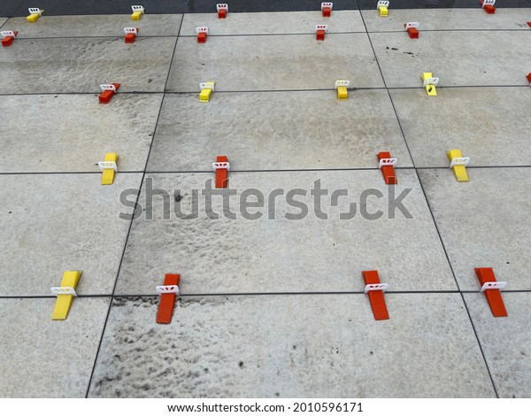 floor tiles laying between colorful\
holders interior decoration interior design detail macro shot\
abstract pastel wonderful background images buying.\
