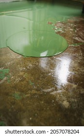 Floor Under Renovation With Green Epoxy Resin.Applied Over Polished And Sealed Concrete