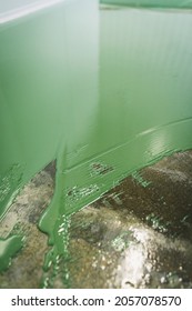 Floor Under Renovation With Green Epoxy Resin.Applied Over Polished And Sealed Concrete