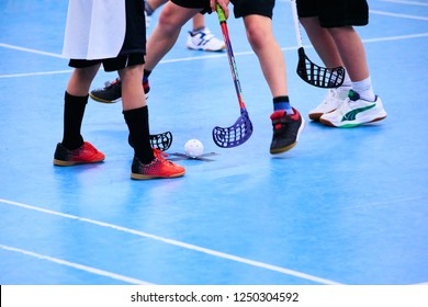 Floorball child boy player with stick and ball. Children playing florball sport