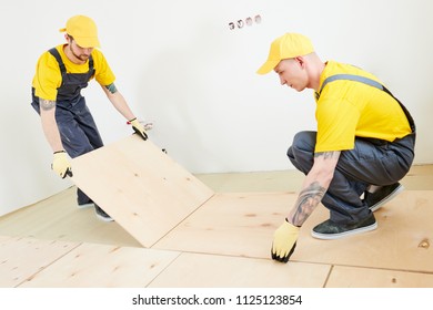 Flooring Work. Plywood Installation At Preparation For Wood Parquet Floor