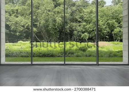 Floor-to-ceiling window with garden view in empty spacious room. Interior design