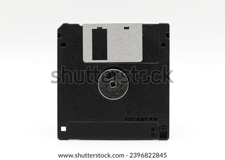 Floppy disk of 1.4 megabytes isolated on white background. Vintage storage for computer. Back side