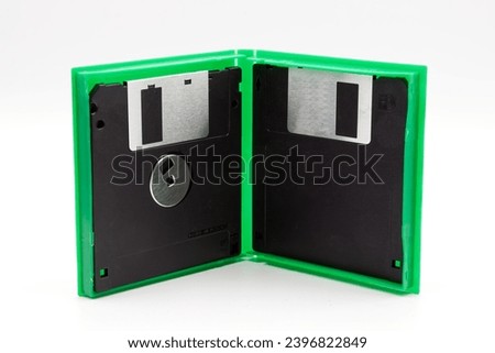 Floppy disk of 1.4 megabytes isolated on white background. Vintage storage for computer inside a box
