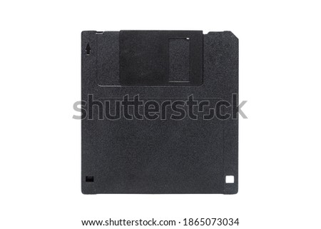 floppy disk in a black square plastic case with free space for copy space, obsolete computer technology device memory carrier 90s isolated on white background, front view, nobody.