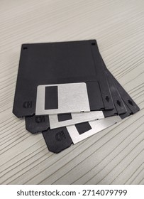 Floppy disk or diskette, a removable magnetic storage medium widely used in the 1980s and 1990s for storing and transferring digital data. Isolated and focused background. 