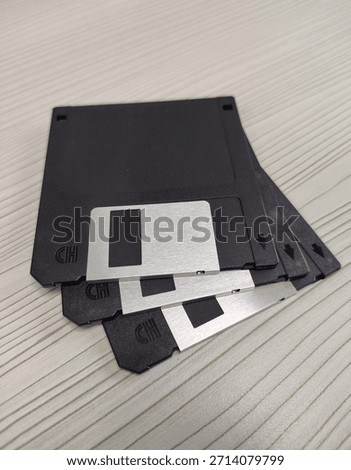 Floppy disk or diskette, a removable magnetic storage medium widely used in the 1980s and 1990s for storing and transferring digital data. Isolated and focused background. 