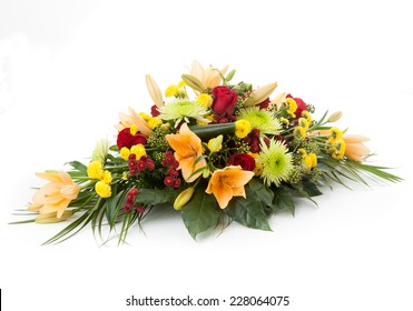 Floral Arrangement Made Of Lily, Chrysanthemum And Red Roses.