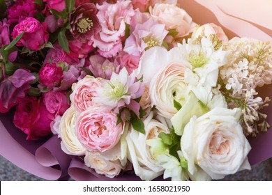 Floral background, texture. Rich elegant wedding bouquet, flowers arrangement by florist with white and pink roses close up, macro
