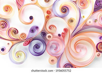 Floral curls and rolls from colored strips of paper. Quilling paper is an art hobby. Abstract background from paper filigree strips. Floral pattern from quilling paper stripes.