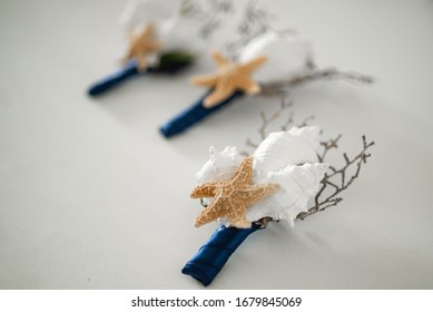 A Boutonnière Is A Floral Decoration, Typically A Single Flower Or Bud, Worn On The Lapel Of A Tuxedo Or Suit Jacket.
