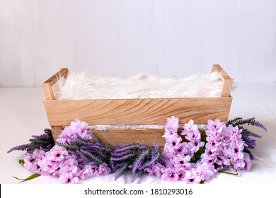 Floral digital background for newborn photography with wooden crib and flowers.