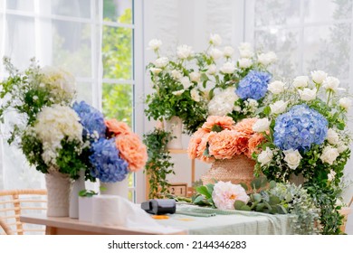 floral flower bouquet business shop,beaufiful fresh flower hydrangea white rose and natural basket arrange with order on table in flower small business shop morning light