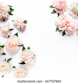 Floral Frame Wreath Made Of Pink And Beige Peonies Flower Buds, Eucalyptus Branches And Leaves Isolated On White Wooden Background. Flat Lay, Top View. Frame Of Flowers. 