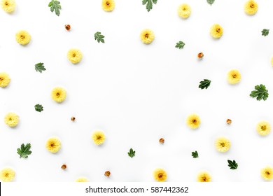 Floral Frame With Yellow Chrysanthemum Flower And Green Branches. Flat Lay, Top View