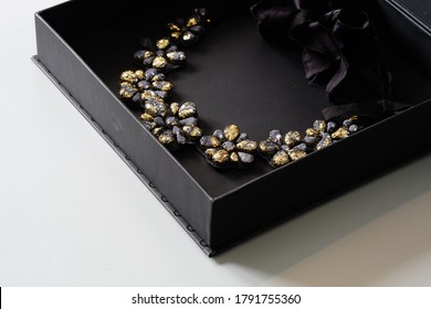 Floral Necklace, Woman Jewelry In Black Box On A Gray Background, Goth, Dark Fashion. Black And Gold Necklace,