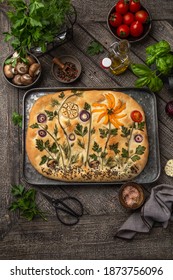 Floral Painting Focaccia,  Garden Flatbread Art, Food Trend. Old Wooden Background, Top View