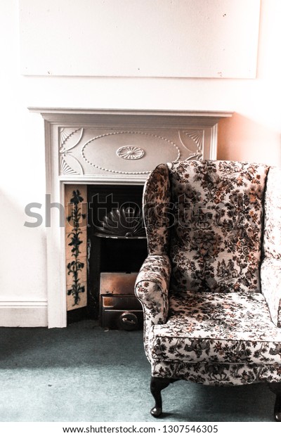 Floral Printed Armchair Fireplace Mantel Piece Royalty Free