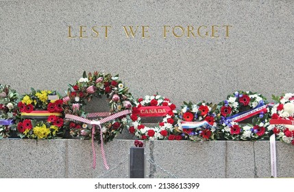 Floral Wreaths Laid At The Sydney Cenotaph On Anzac Day. With Text Reading 