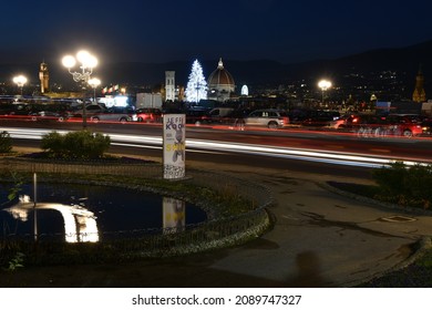 Florence, 12 December 2021: Cityscape of Florence with the Cathedral of Santa Maria del Fiore and illuminated Christmas tree  seen from Michelangelo square in Florence. Italy
