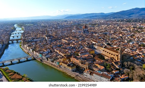 Florence, Capital Of Italy’s Tuscany Region, Is Home Of Renaissance Art And Architecture. Aerial View Iconic Sight  Of Santa Maria Del Fiore With Beautiful City Landscape And Arno River