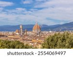 Florence city, Firenze architecture in Italy. Santa Maria del Fiore Cathedral, Duomo huge domes and walls as part of night cityscape from the hill above the city