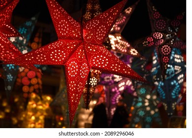 Florence, December 2019: Colorful Star Lamps at the Christmas market in Florence, Italy.