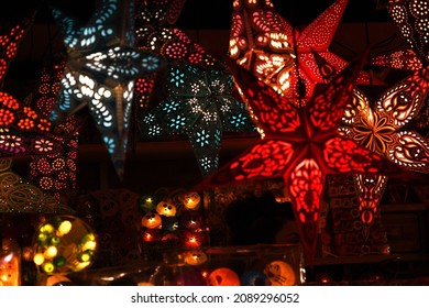 Florence, December 2019: Colorful Star Lamps at the Christmas market in Florence, Italy.