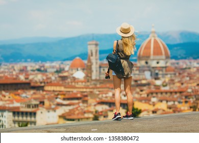 Florence Europe Italia travel summer tourism holiday vacation background -young  girl with camera in hand standing on the hill looking on the cathedral - Shutterstock ID 1358380472
