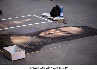 Florence, Italy - 09202019: A drawn painting of Mona Lisa on a street floor by an artist in Florence Italy.