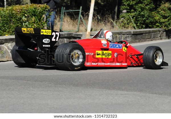 Florence, ITALY - 10 March 2012:\
Classic Formula One in action 1985 Ferrari F1 156-85 Turbo during\
public event of historical parade at Fiesole (Florence) in\
Italy.