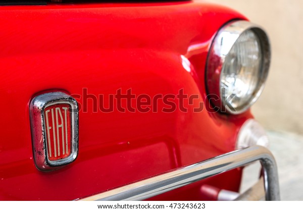 Florence, Italy - April 25,\
2016. Front part of Fiat 500L with old-fashioned logo and round\
headlight