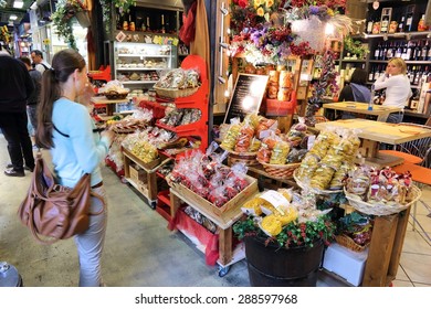 FLORENCE, ITALY - APRIL 30, 2015: People shop at Mercato Centrale market in Florence, Italy. The market is an ultimate Italian shopping experience. It was opened in 1874.