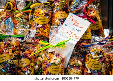 Florence, Italy - August 30, 2018: Firenze Mercato Centrale Central Market Closeup Of Dried Colorful Pasta Sign For Price On Retail Display In Stall