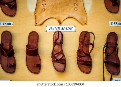 Florence, Italy - August 30, 2018: Many Leather Shoes Closeup With Price Colorful On Display In Shopping Store Shop In Firenze In Tuscany With Nobody