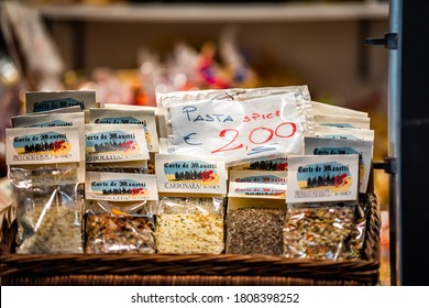 Florence, Italy - August 30, 2018: Firenze Mercato Central Market Closeup Of Dried Herbs Spices Mix For Pasta Colorful And Sign Price In Retail Display In Stall