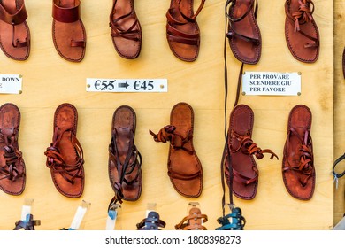 Florence, Italy - August 30, 2018: Many Leather Shoes With Price Reduction Sale Discount Colorful On Display In Shopping Store Shop In Firenze In Tuscany With Nobody