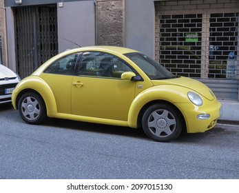 FLORENCE, ITALY - CIRCA DECEMBER 2021: Yellow Volkswagen New Beetle Car