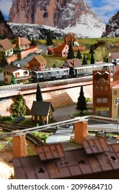 Florence, ITALY - December 2021: Miniature railway model with trains. Mountains ambientation.