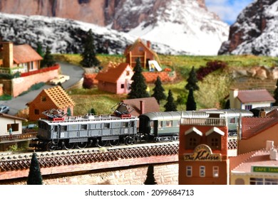 Florence, ITALY - December 2021: Miniature railway model with trains. Mountains ambientation.
