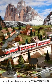 Florence, ITALY - December 2021: Railway model with Swiss Bernina Express Train in mountains ambientation.