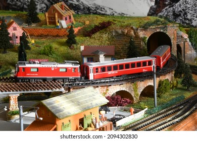 Florence, ITALY - December 2021: Railway model with Swiss Bernina Express Train in mountains ambientation.