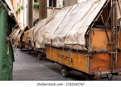 Florence, Italy, June 3, 2019: View Of Outdor Market Portable Stall Trolleys Packed Up Overnight And Waiting For The New Days Trading At A Plaza In The Centre Of Florence