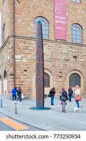 FLORENCE, ITALY - MARCH 14, 2015 : Monumental Sundial (Sun Clock) Near Museo Galileo In Florence With Tourists Around. Italy.
