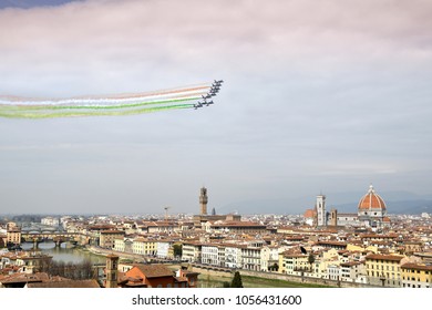Florence, Italy - March, 28 2018: Airshow of PAN Frecce Tricolori. The Frecce Tricolori in the sky of Florence for 95th birthday of the Italian Air Force in Florence. The team flies the Aermacchi MB-3