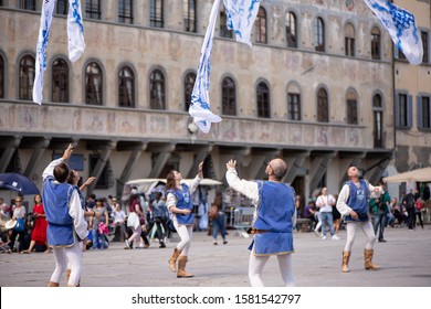 Florence, Italy / May, 16, 2017:
Italian flag bearers demonstrate their skill by juggling and flipping flags
