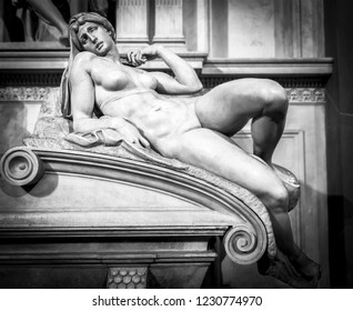 FLORENCE, ITALY - OCTOBER 7, 2018: A marble sculpture "Dawn" by Michelangelo, datable to 1524-34 on the tomb of Lorenzo II de' Medici in the Medici Chapel in San Lorenzo in Florence.
