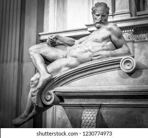FLORENCE, ITALY - OCTOBER 7, 2018: A marble sculpture "Dusk" by Michelangelo, datable to 1524-34 on the tomb of Lorenzo II de' Medici in the Medici Chapel in San Lorenzo in Florence.